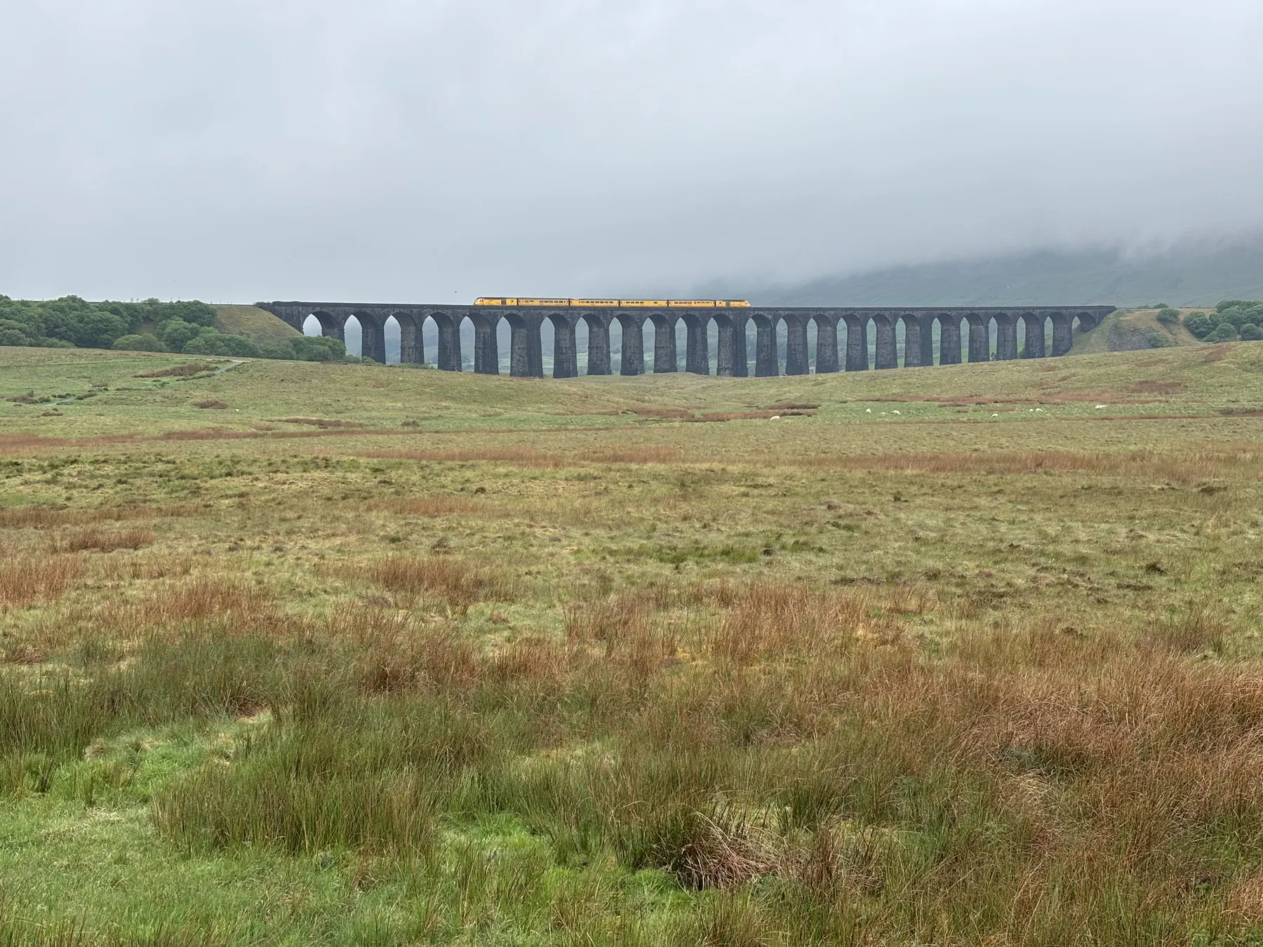 A steam train crossing the Ribblehead Viaduct